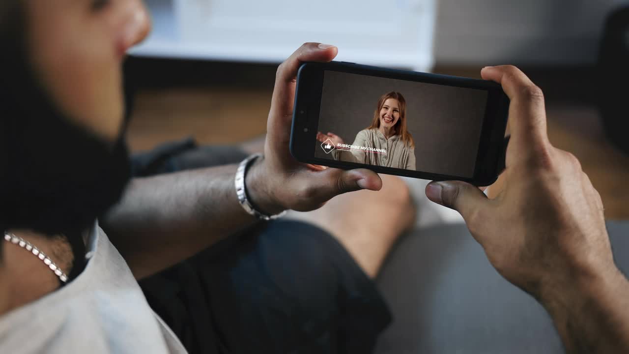 Stock Video Man Watching A Video On His Smartphon Animated Wallpaper