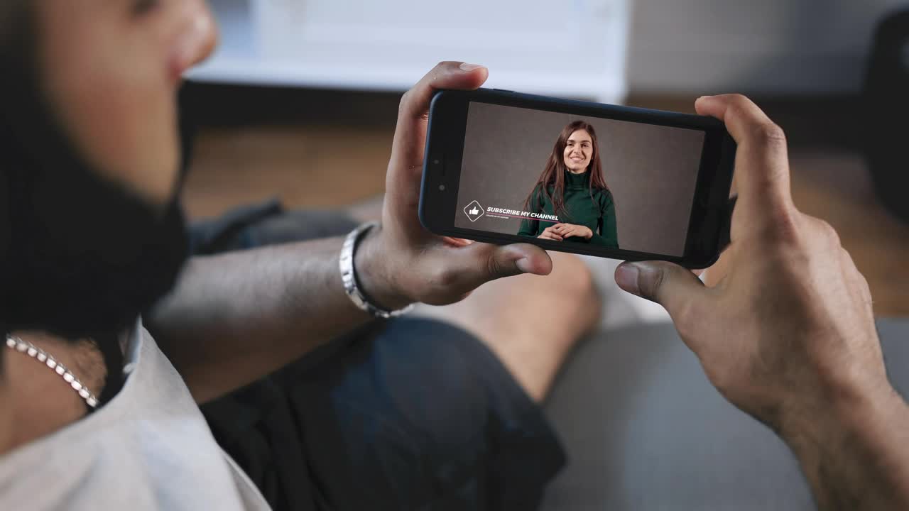 Stock Video Man Watches Youtube Influencer Asks For Subscribers To Click Lik Animated Wallpaper