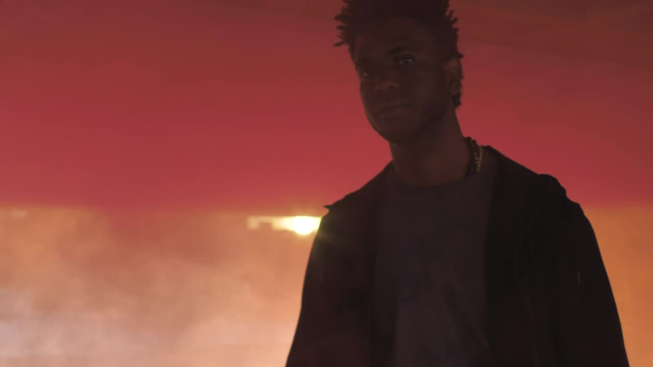 Stock Video Man Walking Through Colorful Smoke Bomb Animated Wallpaper