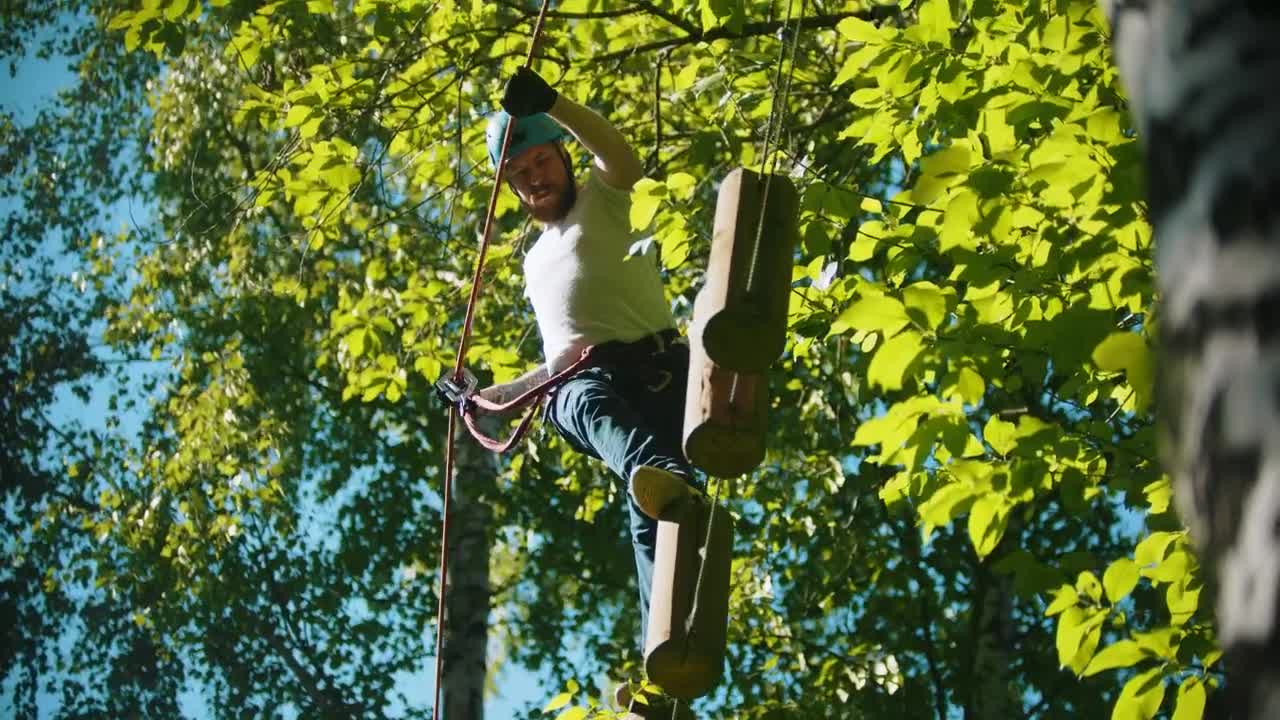 Stock Video Man Walking On Floating Logs In The Wood Animated Wallpaper