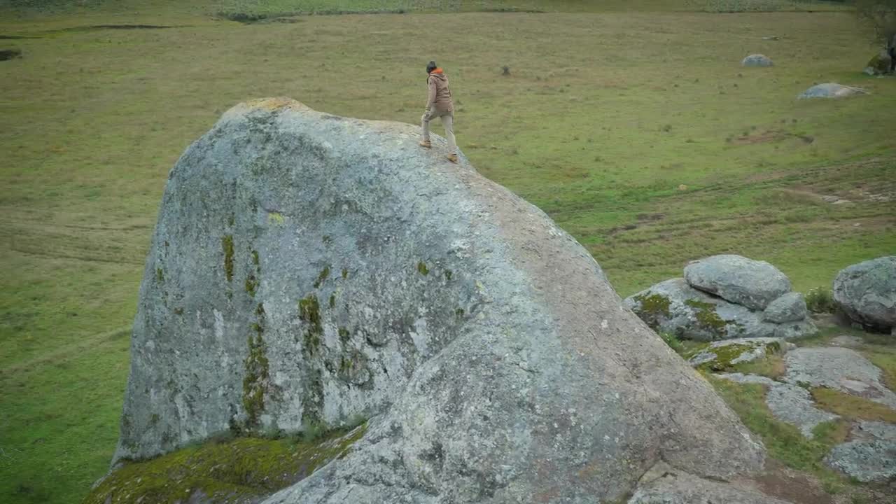 Stock Video Man Walking On A Giant Ston Animated Wallpaper