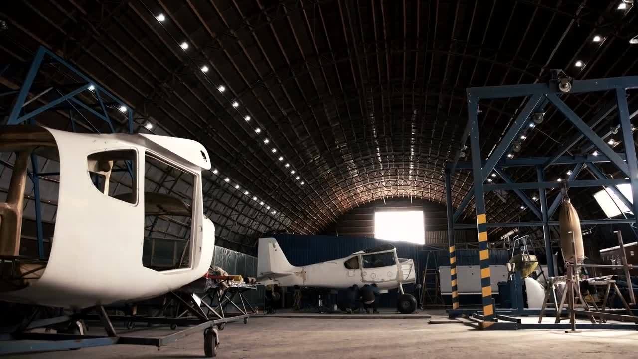 Stock Video Man Walking In An Aircraft Hanga Animated Wallpaper