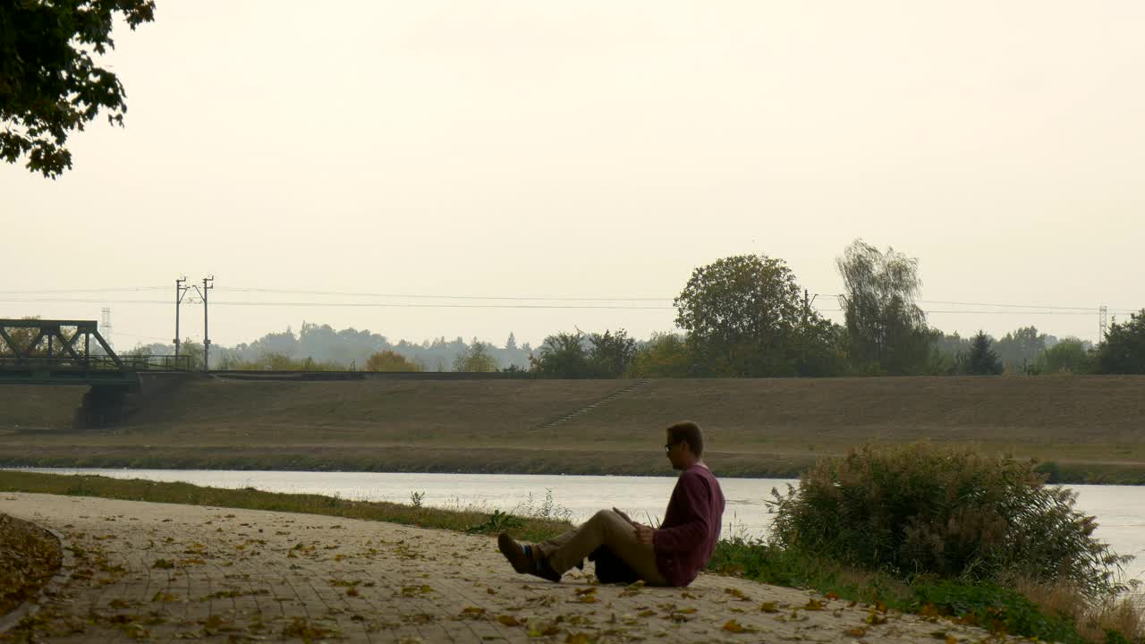 Stock Video Man Walking By The Riversid Animated Wallpaper