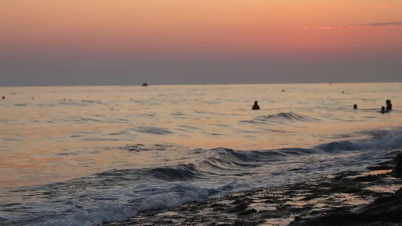 Stock Video Man Walking Along The Shore Of A Beach At Sunse Animated Wallpaper