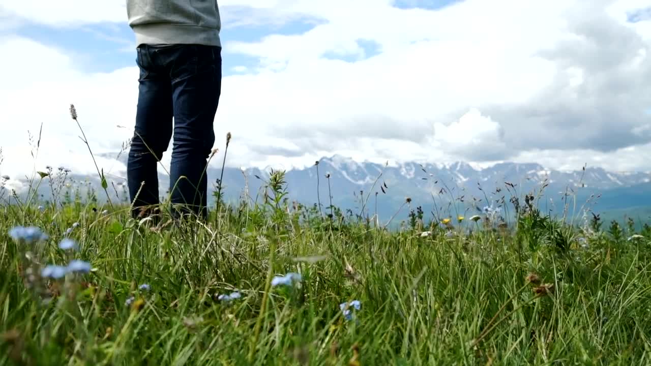 Stock Video Man Using Mobile Gps In Mountain Meado Animated Wallpaper