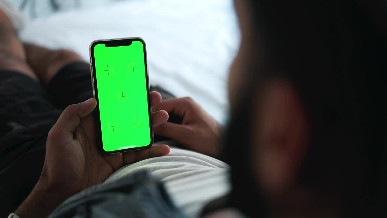 Stock Video Man Using Mobile App Touch Screen With Chromake Animated Wallpaper