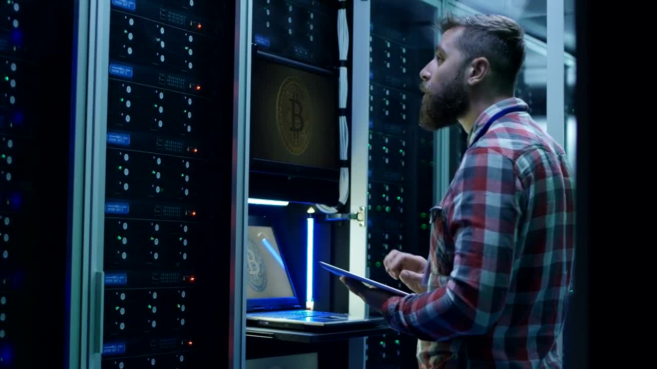 Stock Video Man Using Laptop On Bitcoin Mining Far Animated Wallpaper