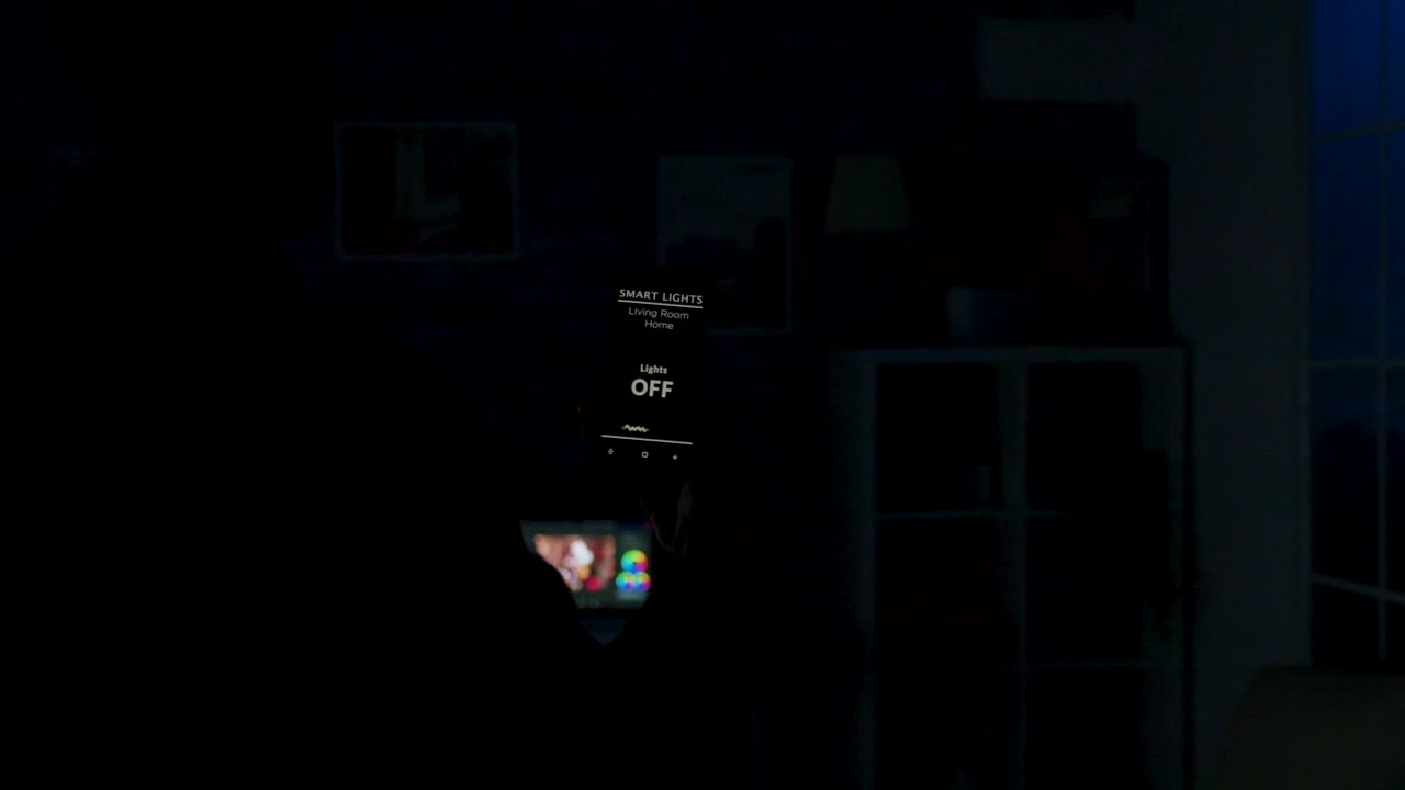 Stock Video Man Using Future App To Control Lighting From Mobile Phon Animated Wallpaper