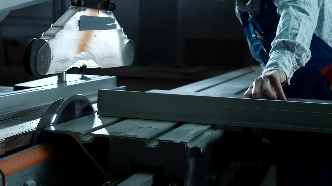 Stock Video Man Using Cutting Machine In The Worksho Animated Wallpaper