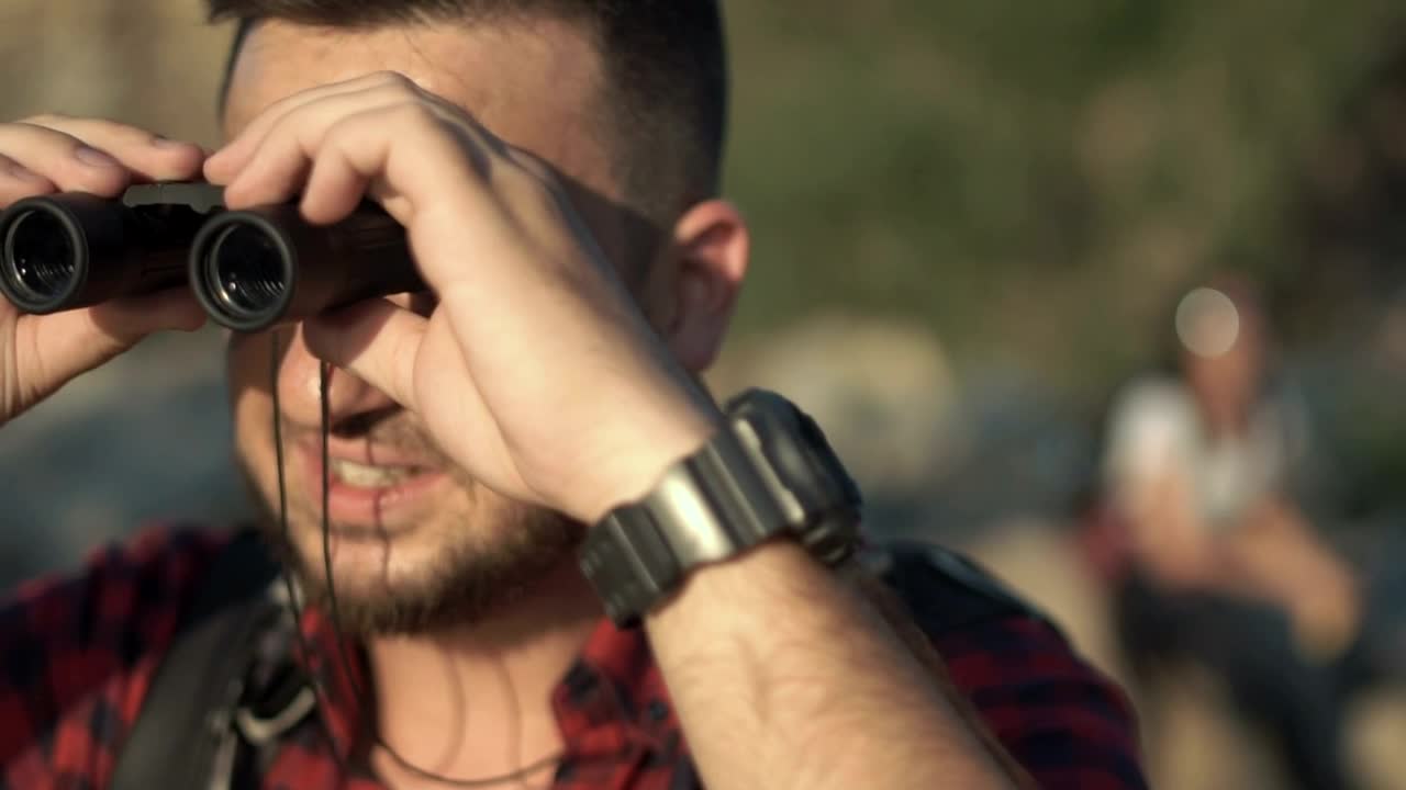Stock Video Man Using Binoculars And Friends Looking At Ma Animated Wallpaper