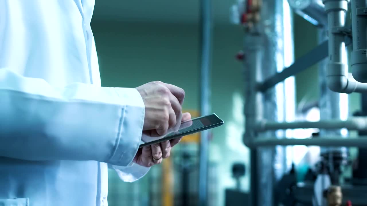 Stock Video Man Using A Tablet In An Industrial Environmen Animated Wallpaper