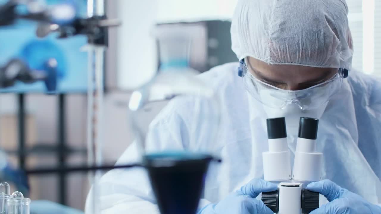 Stock Video Man Using A Microscop Animated Wallpaper