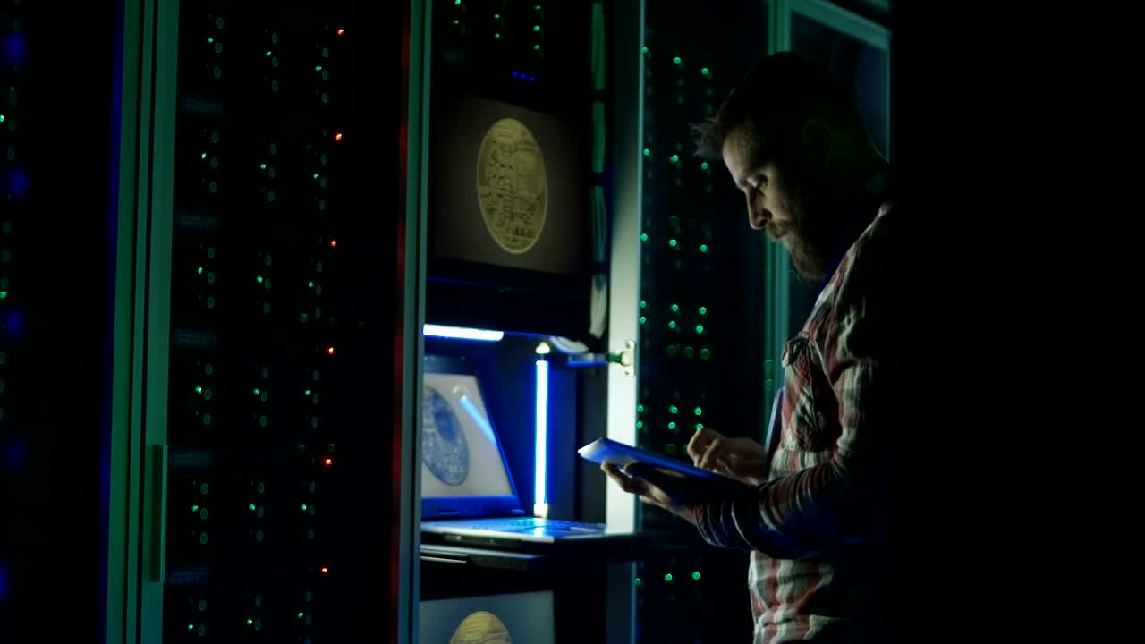 Stock Video Man Using A Laptop In A Dark Room Data Cente Animated Wallpaper