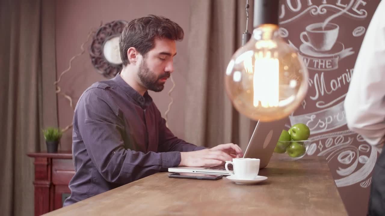 Stock Video Man Uses Mobile Pay In Hip Caf Animated Wallpaper