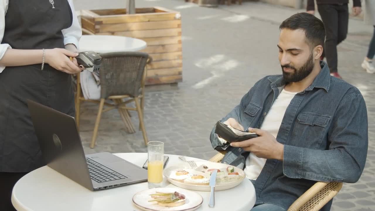 Stock Video Man Uses Credit Card On Pos To Pay For Mea Animated Wallpaper