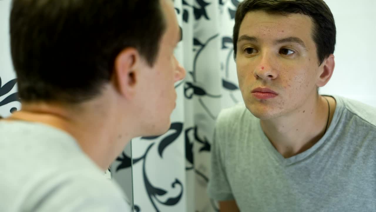 Stock Video Man Unhappy About The Skin Of His Fac Animated Wallpaper