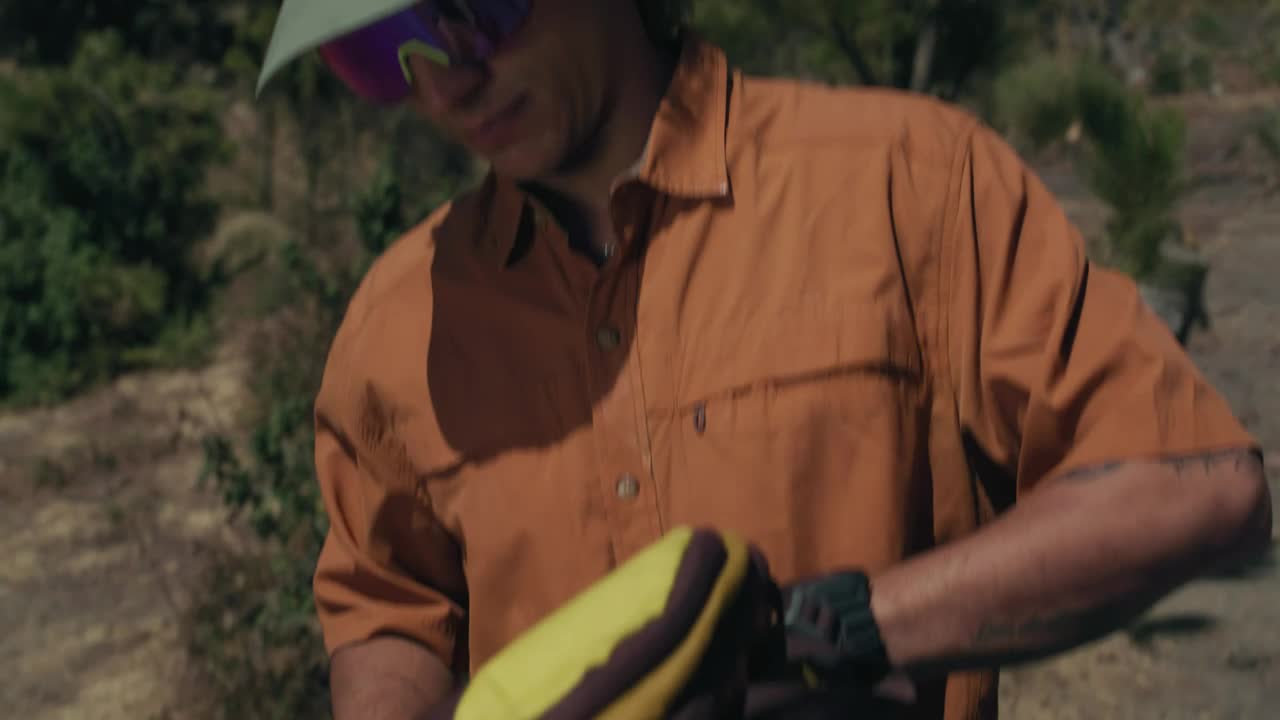 Stock Video Man Unpacking His Camping Gea Animated Wallpaper