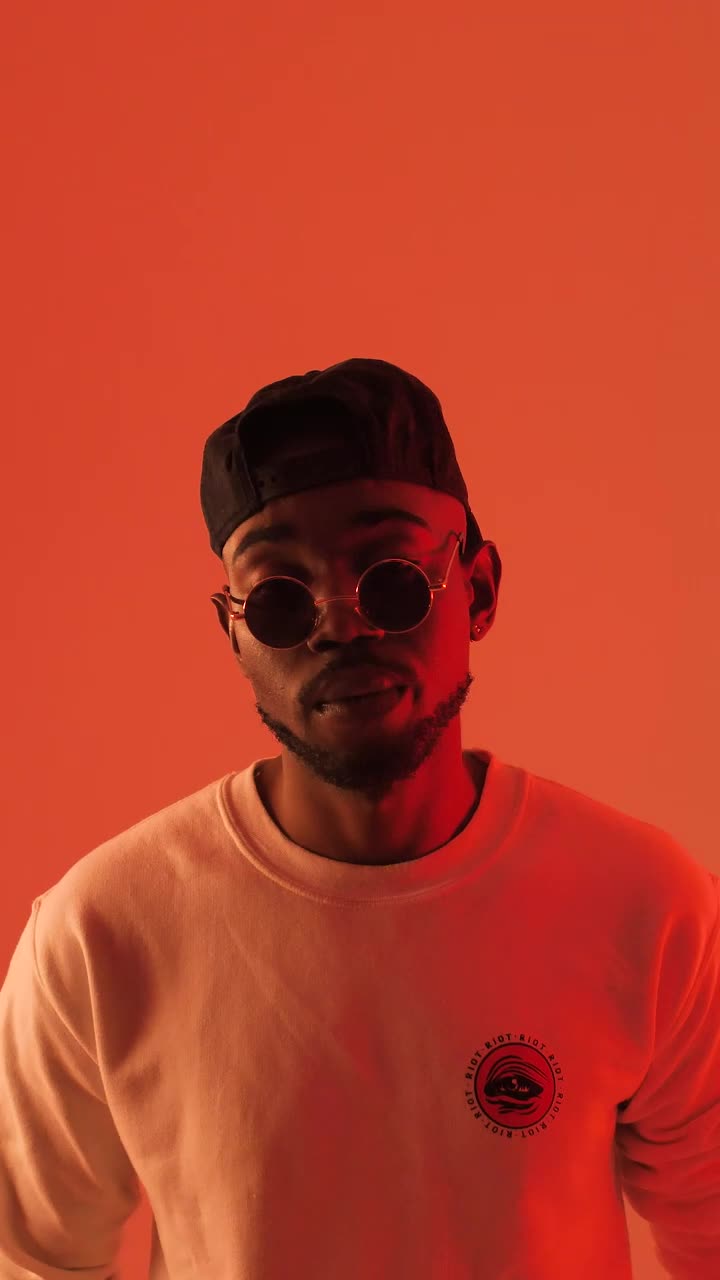 Stock Video Man Under Multicolored Light Animated Wallpaper