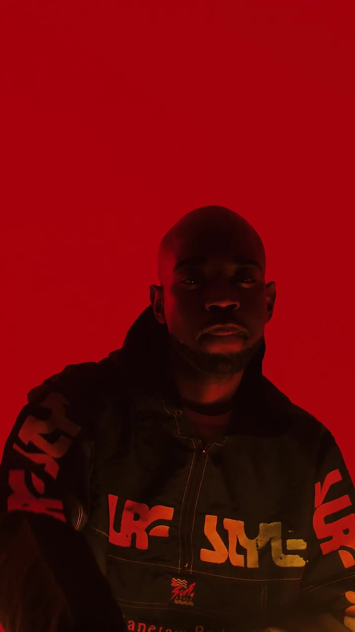 Stock Video Man Under Colored Light Animated Wallpaper