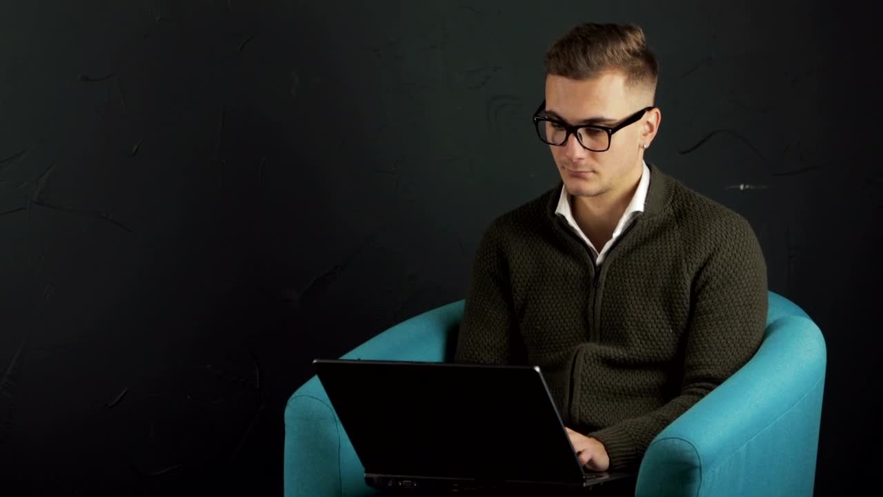 Stock Video Man Typing On Laptop With Black Backgroun Animated Wallpaper