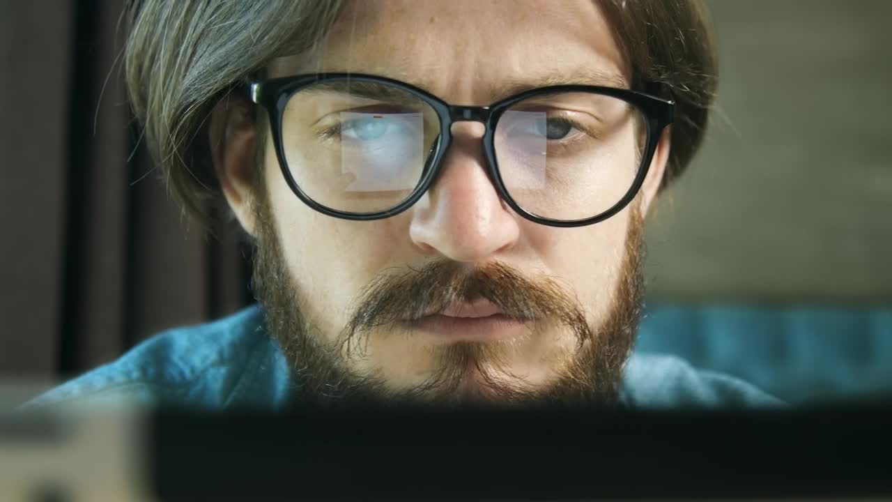 Stock Video Man Typing On Laptop Reflected In Glasse Animated Wallpaper
