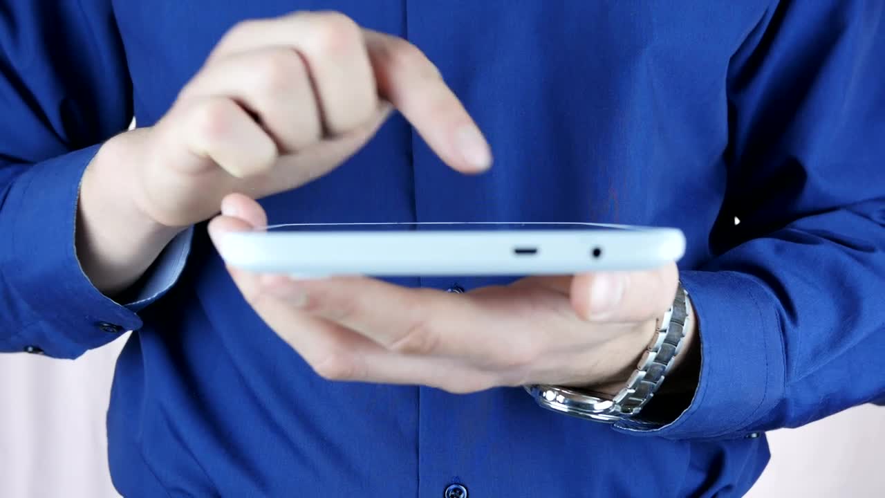 Stock Video Man Typing On A Small Table Animated Wallpaper