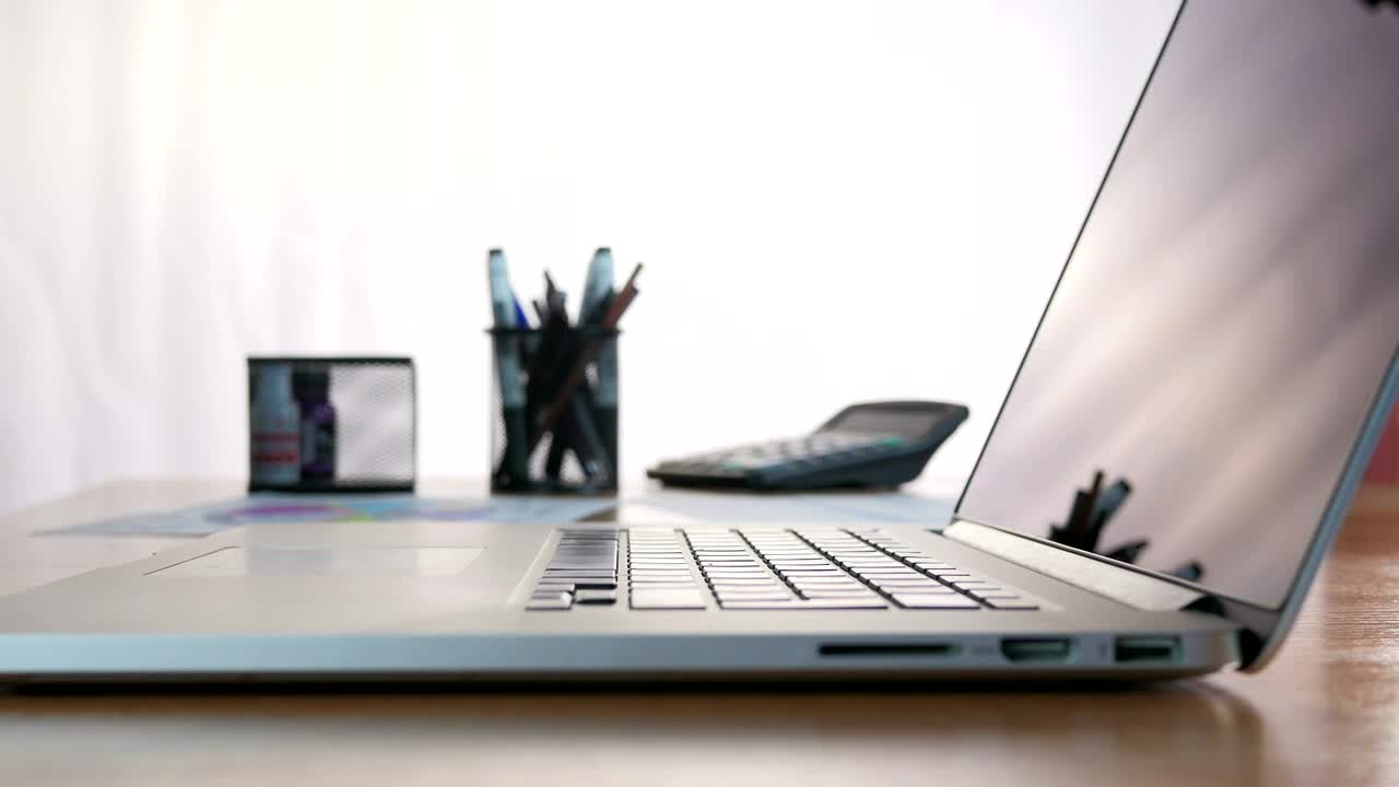 Stock Video Man Typing On A Laptop In The Des Animated Wallpaper