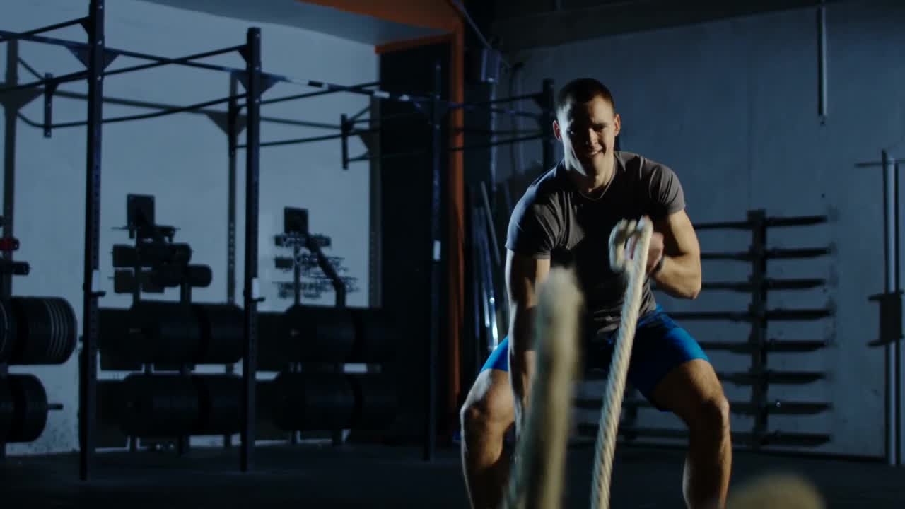 Stock Video Man Training With Ropes In The Gy Animated Wallpaper