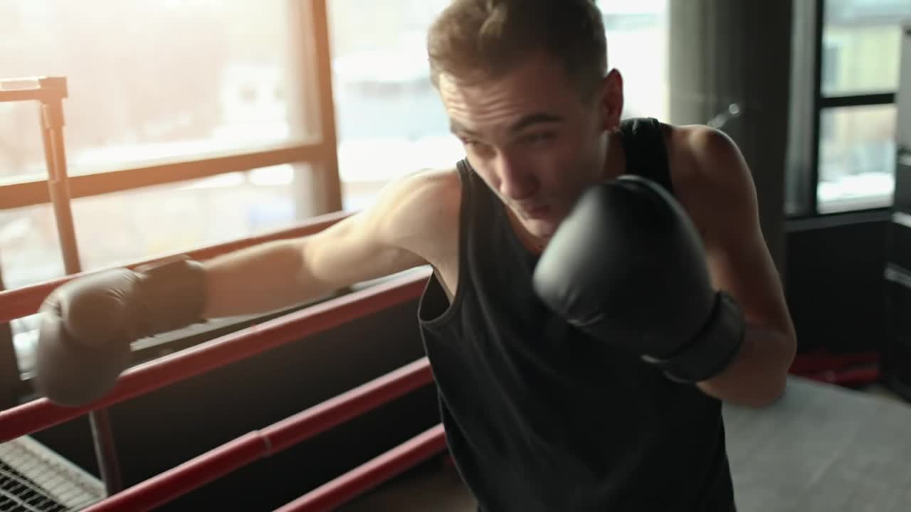 Stock Video Man Training With Gloves In Boxing Rin Animated Wallpaper