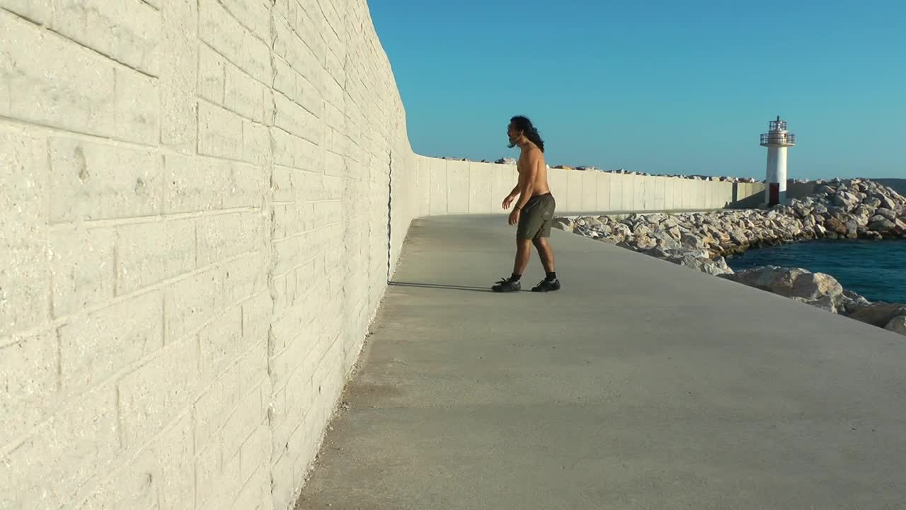 Stock Video Man Training By The Se Animated Wallpaper