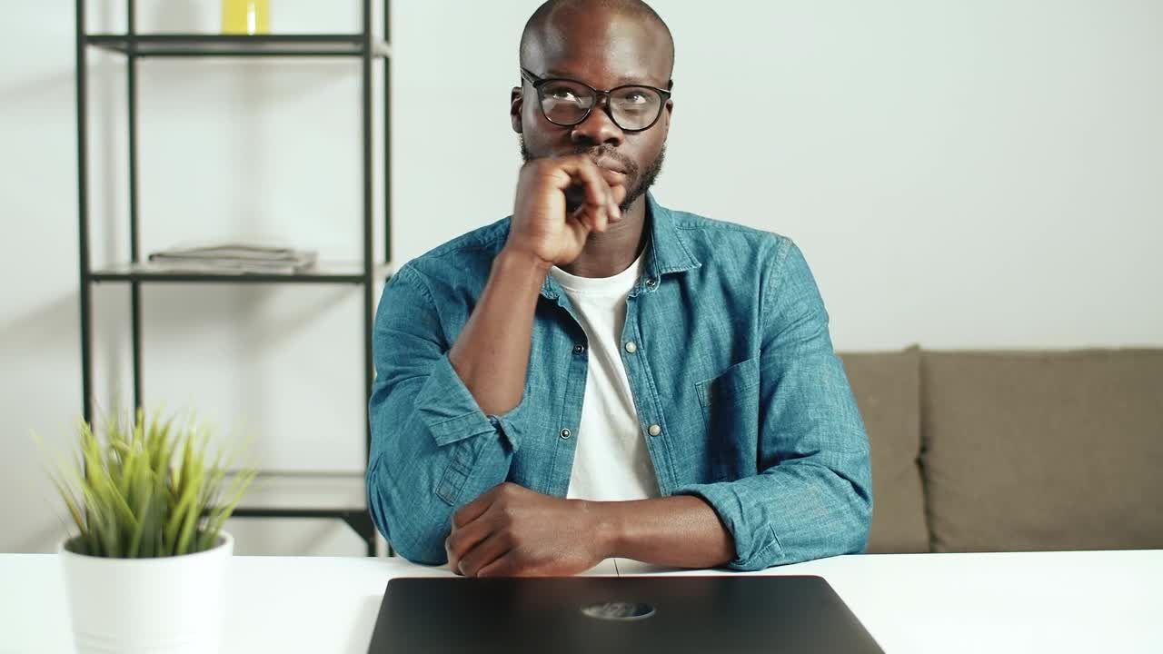Stock Video Man Thinks What To Do Before Starting Wor Animated Wallpaper