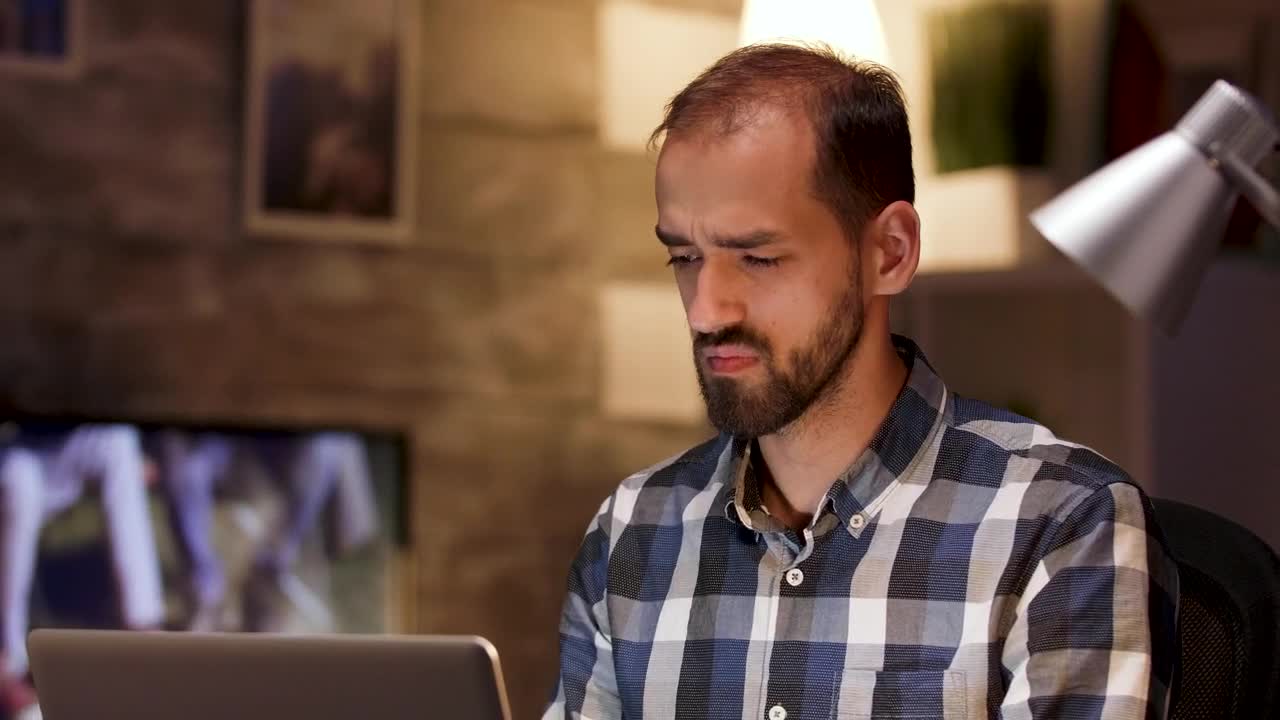 Stock Video Man Thinks Hard While Working On Laptop From Hom Animated Wallpaper