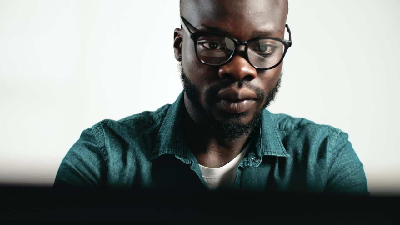 Stock Video Man Thinks And Takes Off Glasses While Workin Animated Wallpaper