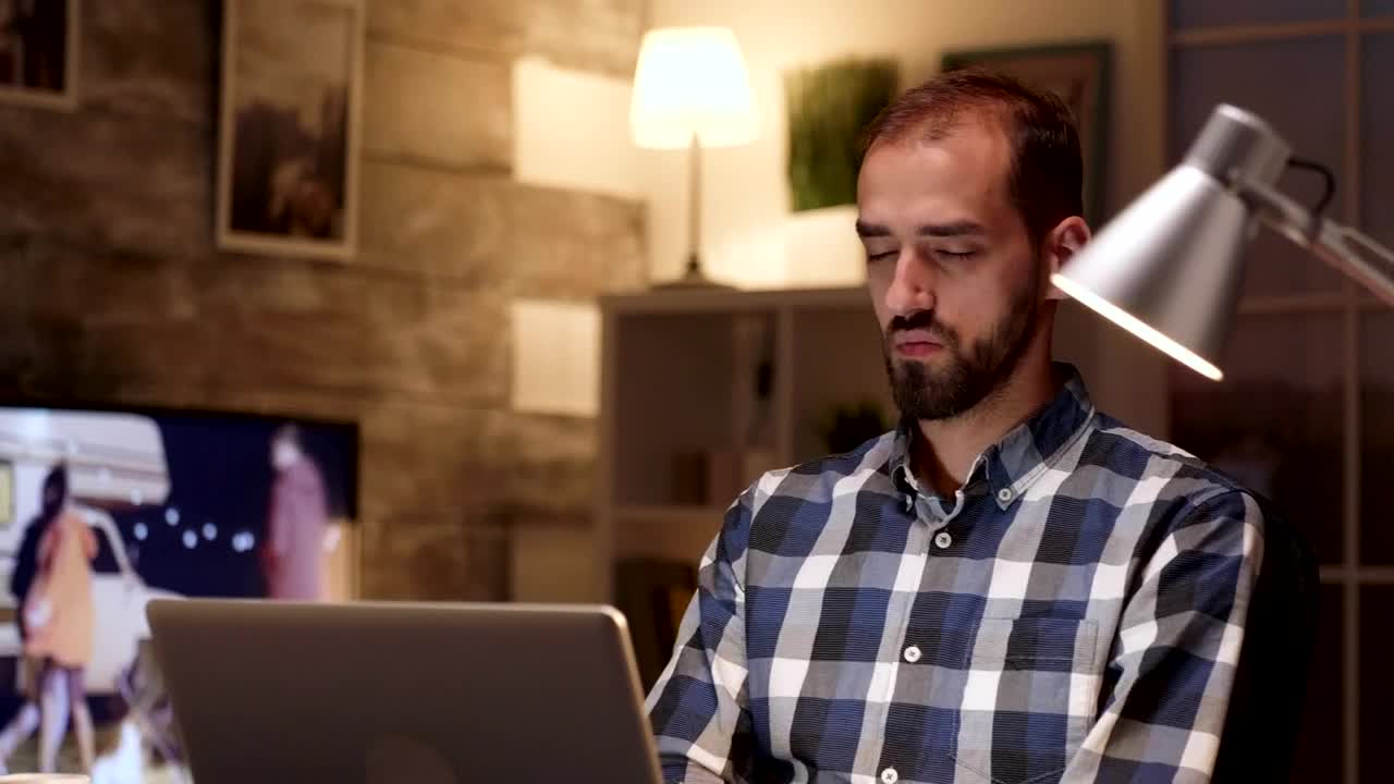 Stock Video Man Thinking While Working On A Lapto Animated Wallpaper