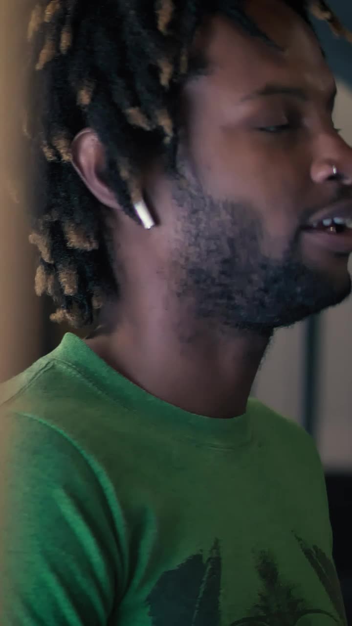 Stock Video Man Talking On The Phone With White Earphone Animated Wallpaper