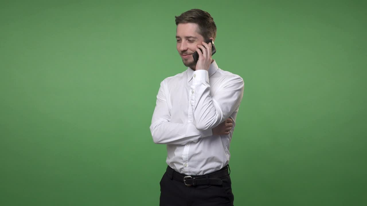 Stock Video Man Talking On His Phone Against A Scree Animated Wallpaper