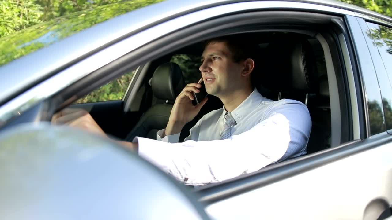 Stock Video Man Talking On His Cell While In His Ca Animated Wallpaper