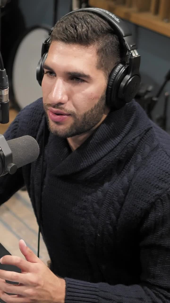 Stock Video Man Talking In Front Of A Radio Station Microphon Animated Wallpaper