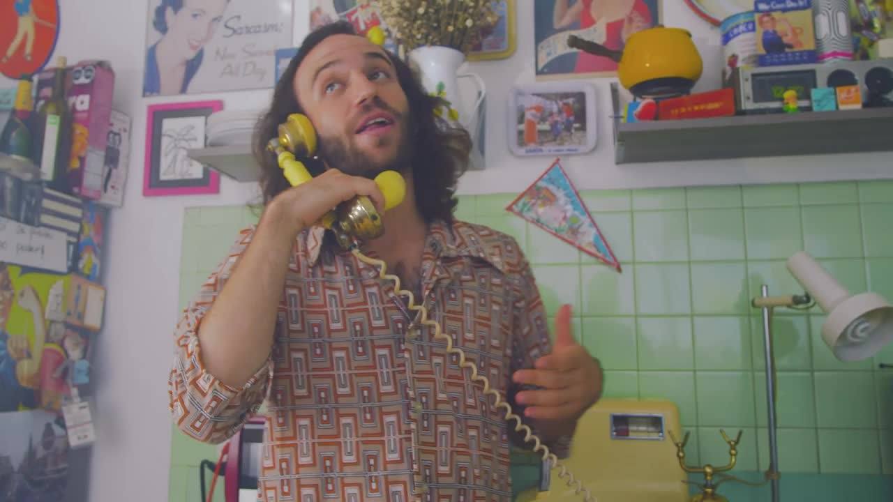 Stock Video Man Talking Cheerfully On An Old Telephon Animated Wallpaper