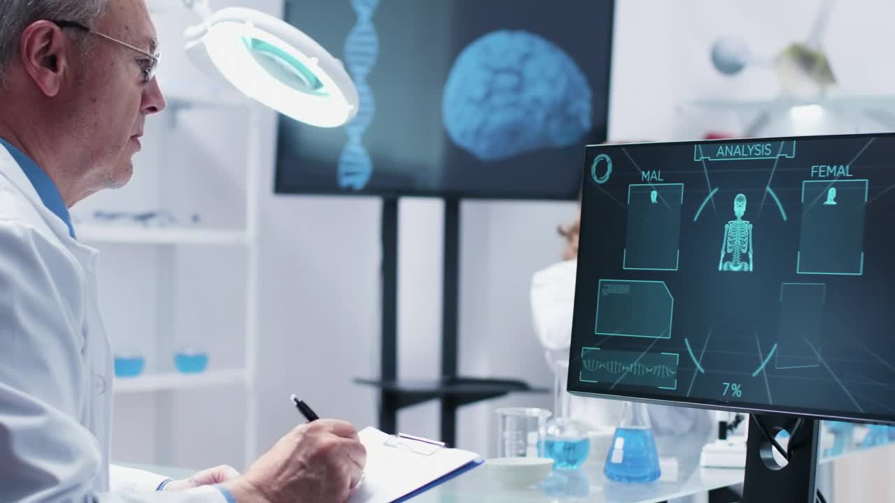 Stock Video Man Taking Notes From A Compute Animated Wallpaper