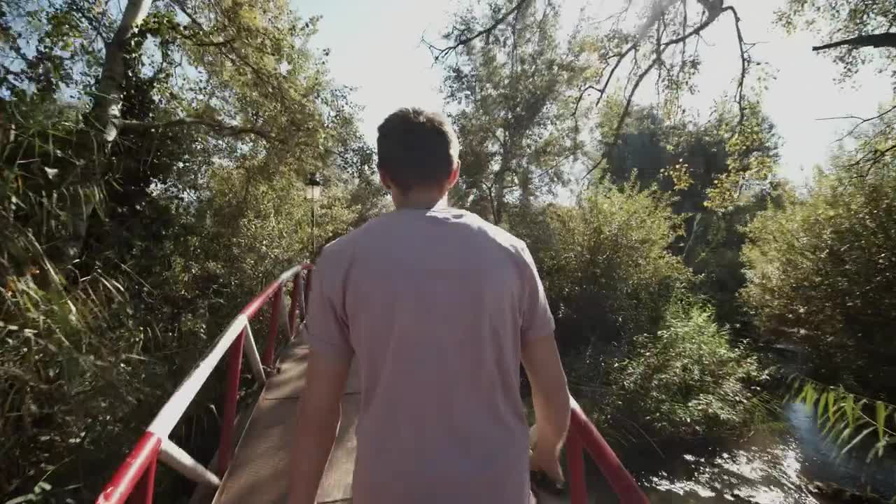 Stock Video Man Taking A Walk Through A Park In Morocc Animated Wallpaper