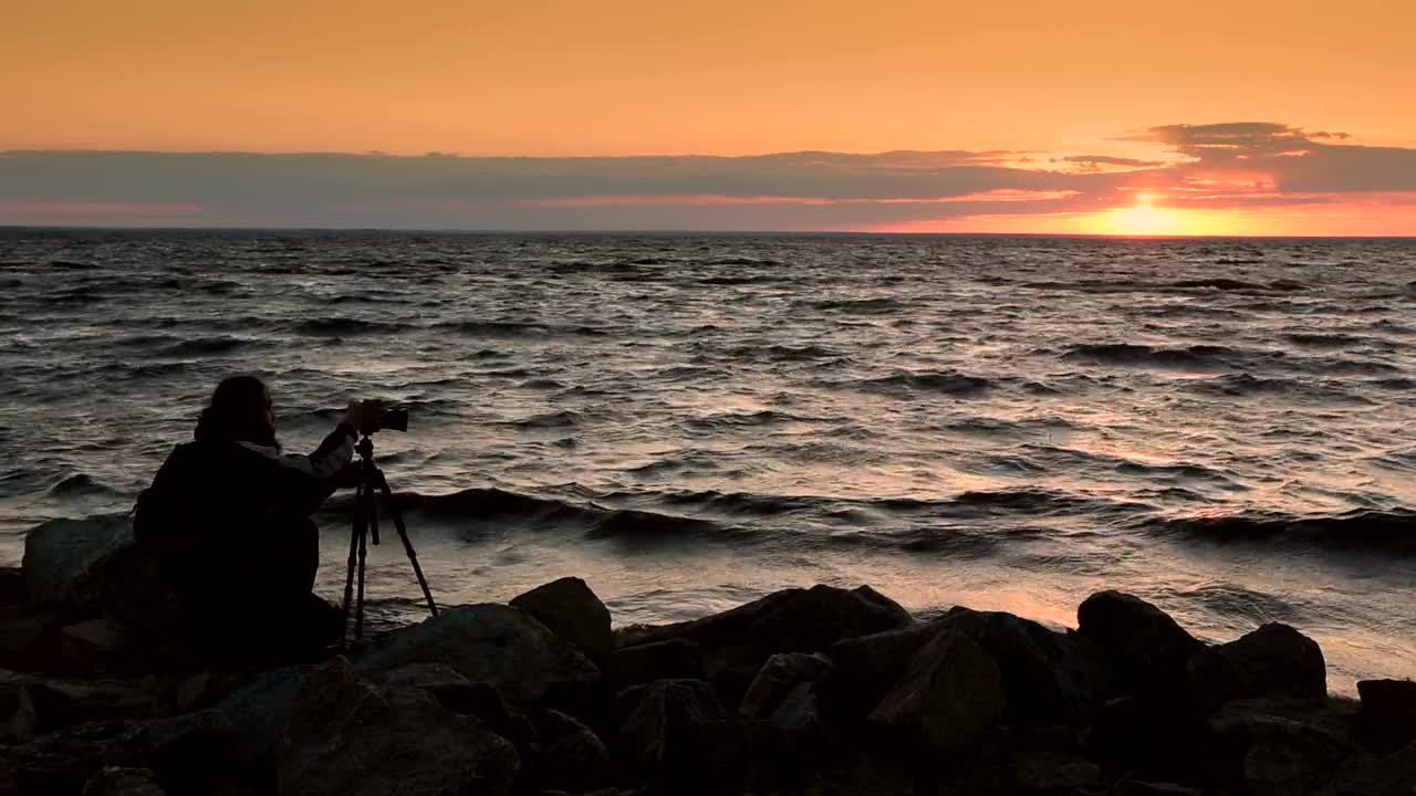 Stock Video Man Taking A Photo Of The Sunse Animated Wallpaper