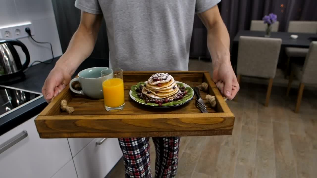 Stock Video Man Taking A Breakfast Tray To His Wif Animated Wallpaper
