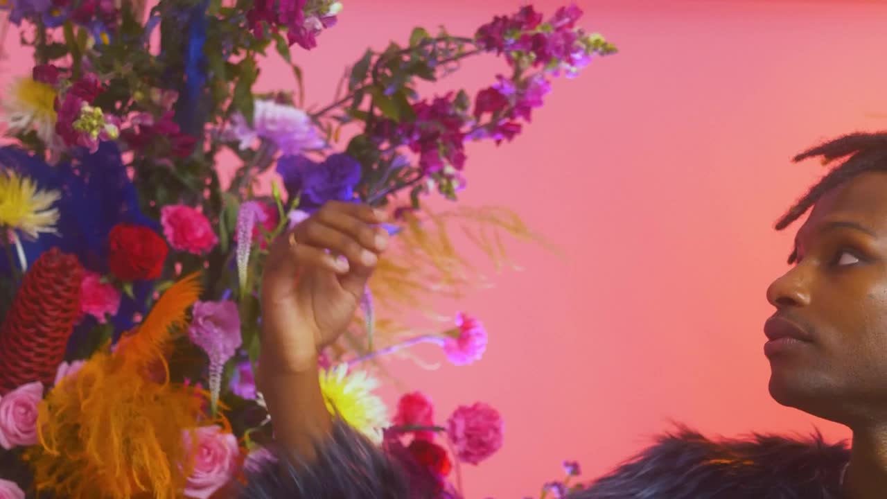 Stock Video Man Stroking The Petals Of A Large Flower Arrangemen Animated Wallpaper