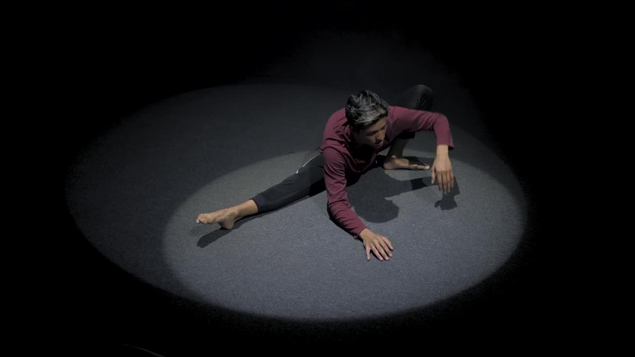 Stock Video Man Stretching In The Spotligh Animated Wallpaper