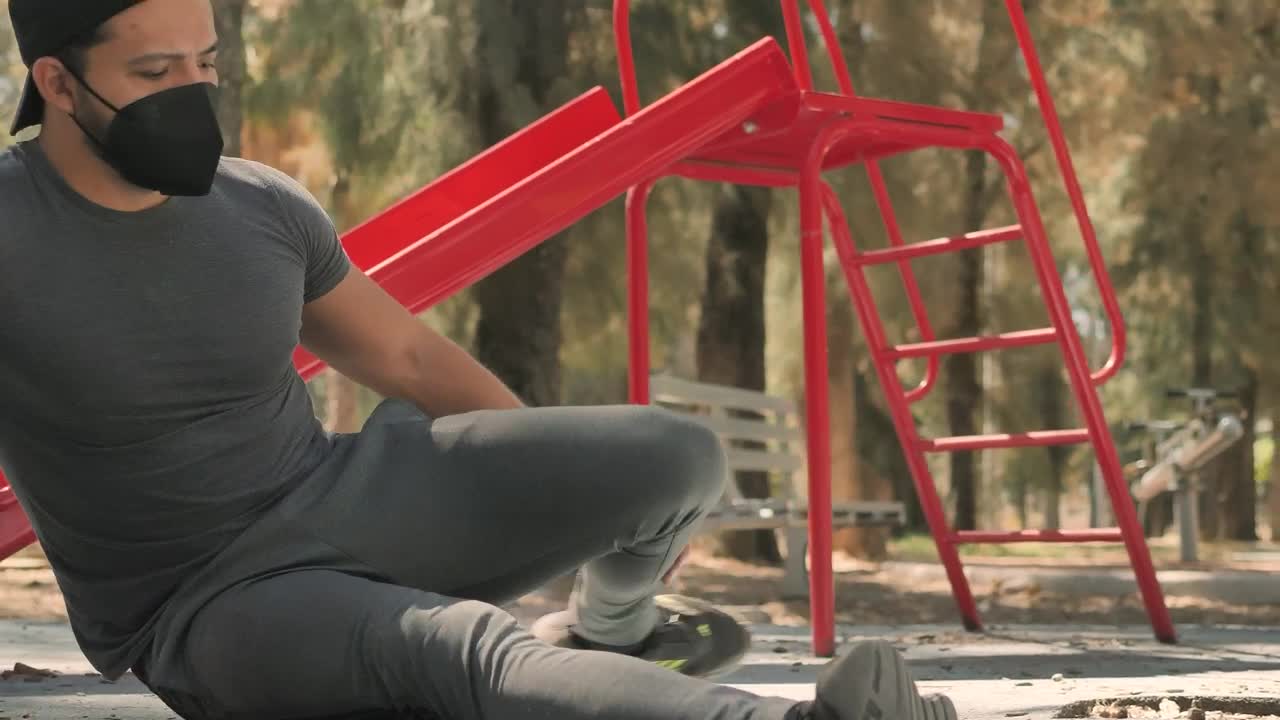 Stock Video Man Stretching His Legs In A Par Animated Wallpaper