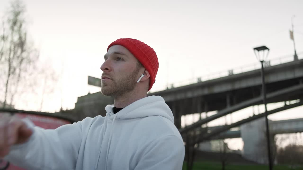 Stock Video Man Stretching Before Exercising On A Cold Da Animated Wallpaper