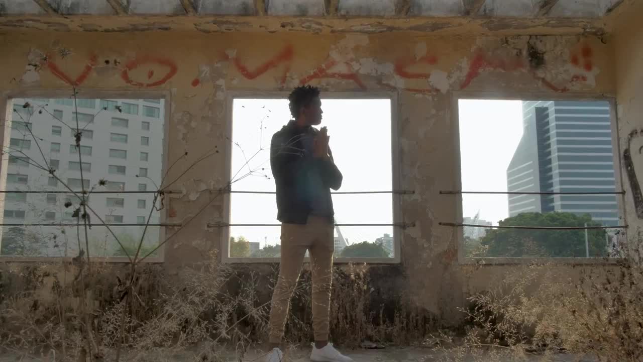 Stock Video Man Standing Outside Abandoned Buildin Animated Wallpaper