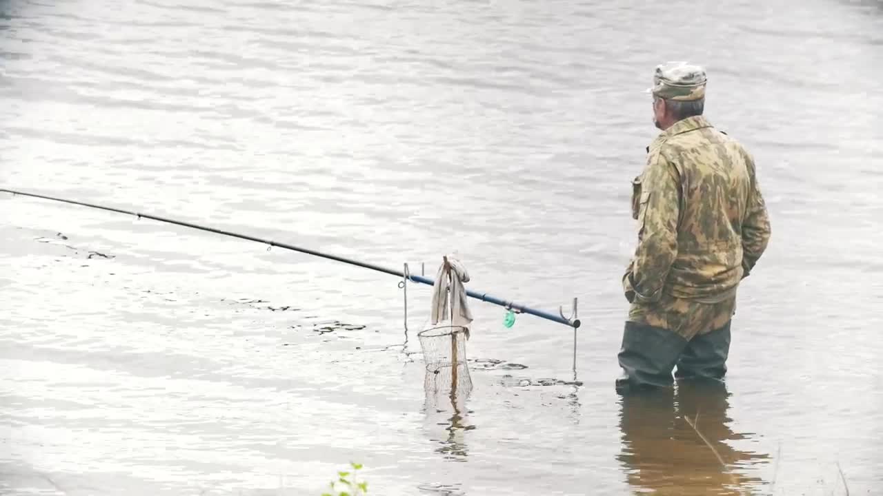 Stock Video Man Standing In A Lake With A Fishing Ro Animated Wallpaper