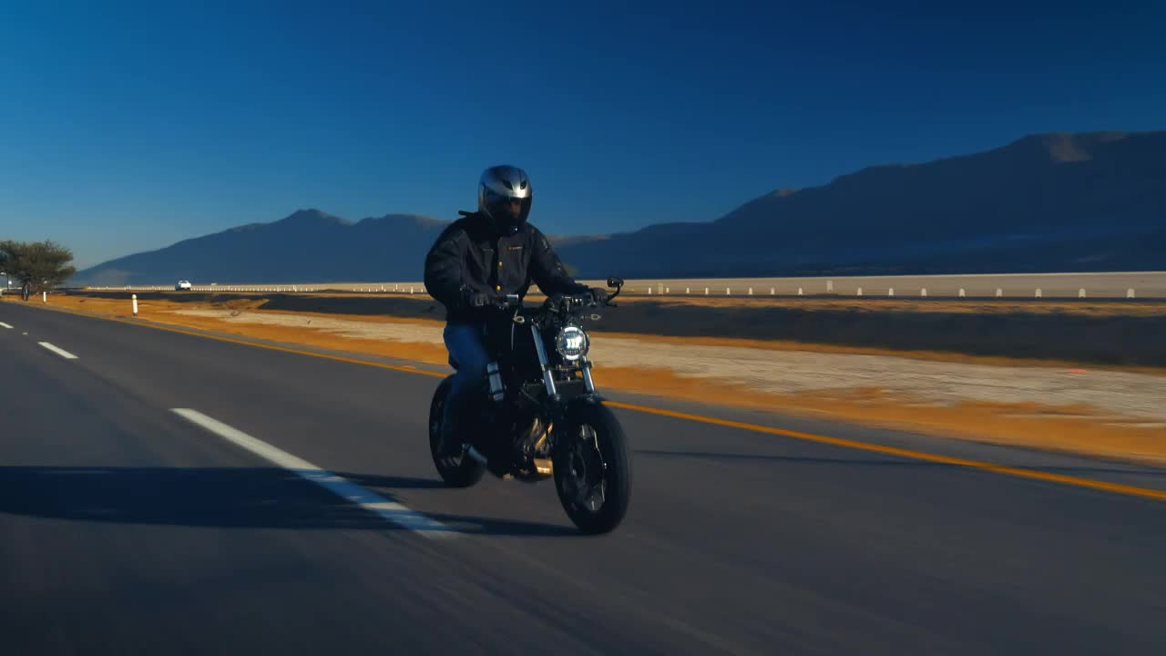 Stock Video Man Speeding A Road On A Motorcycl Animated Wallpaper